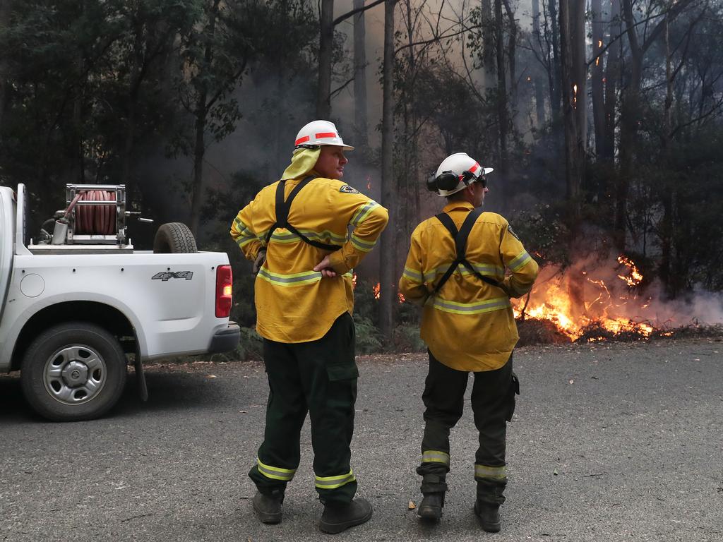 January 2019 Tasmanian Bushfires. Firefighters from Sustainable Timber, Department of Parks and Wildlife and New Zealand work on a spot fire on Arve Rd just out of Geeveston in the Huon Valley. Picture: NIKKI DAVIS-JONES