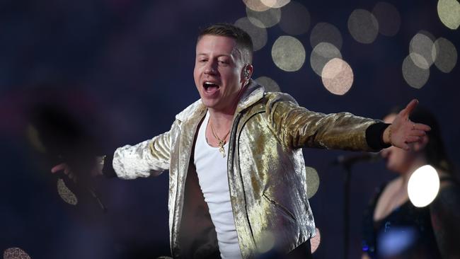 US artist Macklemore performs during the NRL grand final. AAP Image/Dan Himbrechts