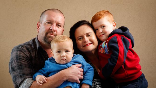 ... but now she’s found happiness as a suburban mum. Now known as Cathy Jayne Hogben, she is pictured with partner Daniel and children Jacob and Levi at their Adelaide home in 2016. Picture: Matt Turner