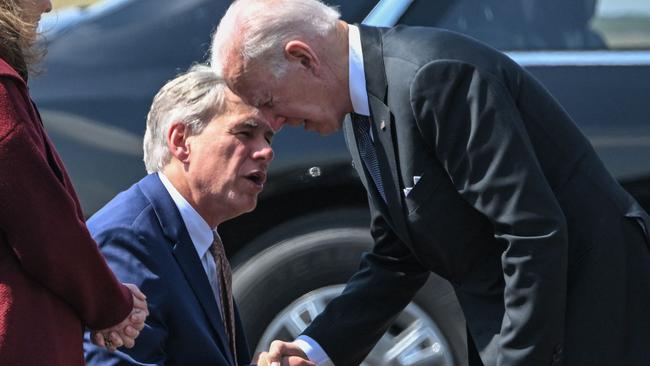 US President Joe Biden greets Texas Governor Greg Abbott in more cordial times. Picture: MANDREL NGAN / AFP