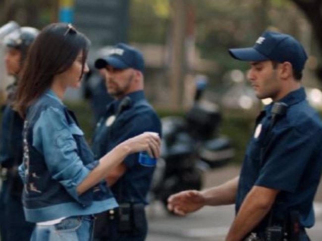 Kendall Jenner handed a cop a Pepsi in the weird ad. Picture: Supplied