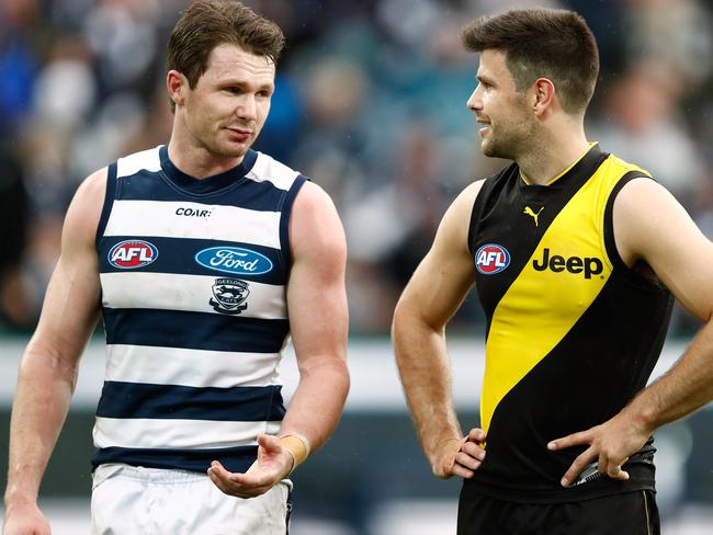 Patrick Dangerfield of the Cats chats to Trent Cotchin of the Tigers.