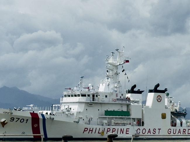 This handout photo from the Philippine Coast Guard (PCG) taken and received on September 15, 2024 shows the Philippine Coast Guard ship BRP Teresa Magbanua as it arrives at a port in Puerto Princesa, Palawan. A Philippine vessel that spent months anchored at a disputed reef in the South China Sea has left the area, the national maritime council said on September 15, 2024. (Photo by Handout / Philippine Coast Guard (PCG) / AFP) / RESTRICTED TO EDITORIAL USE - MANDATORY CREDIT "AFP PHOTO /   Philippine Coast Guard (PCG) " - NO MARKETING NO ADVERTISING CAMPAIGNS - DISTRIBUTED AS A SERVICE TO CLIENTS