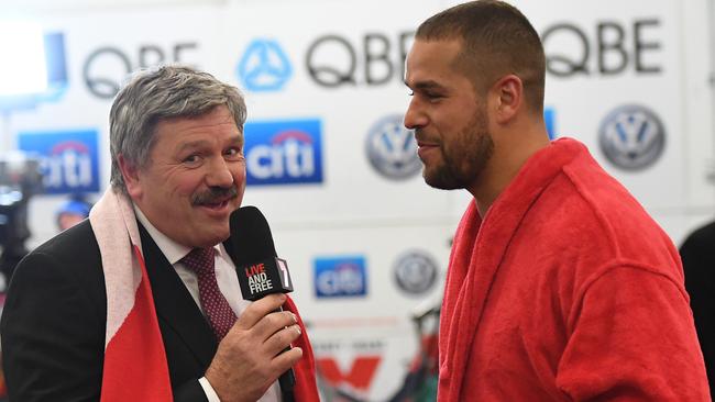 Brian Taylor up to his mischievous best in the Sydney rooms with Lance Franklin.