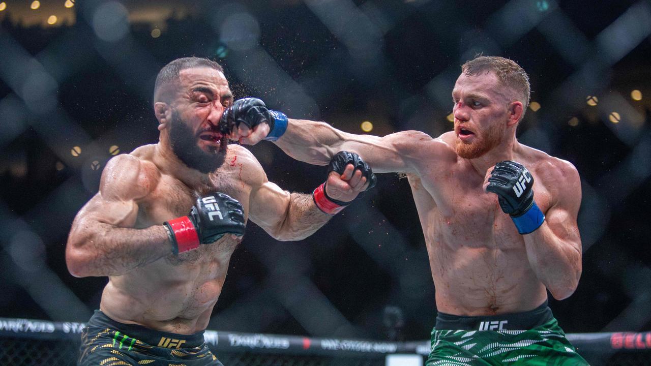 Jack Della Maddalena crushes Belal Muhammad’s face. Photo by Alexis Aubin / AFP.