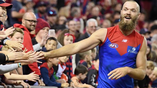 MELBOURNE, AUSTRALIA - APRIL 29:  Max Gawn of the Demons high fives fans after winning the round 6 AFL match between the Essendon Bombers and Melbourne Demons at Etihad Stadium on April 29, 2018 in Melbourne, Australia.  (Photo by Quinn Rooney/Getty Images)