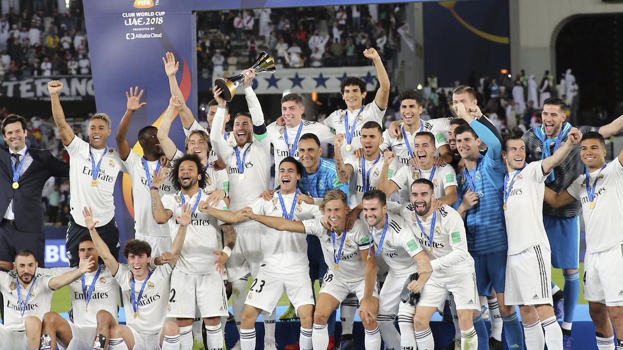 Real Madrid celebrate with the trophy after winning the Club World Cup