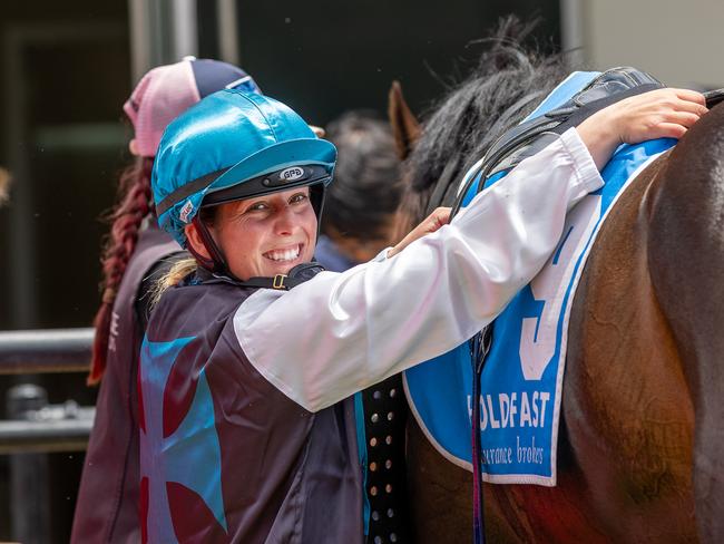 Apprentice jockey Chelsey Reynolds unsaddles after a winner. Picture: Makoto Kaneko