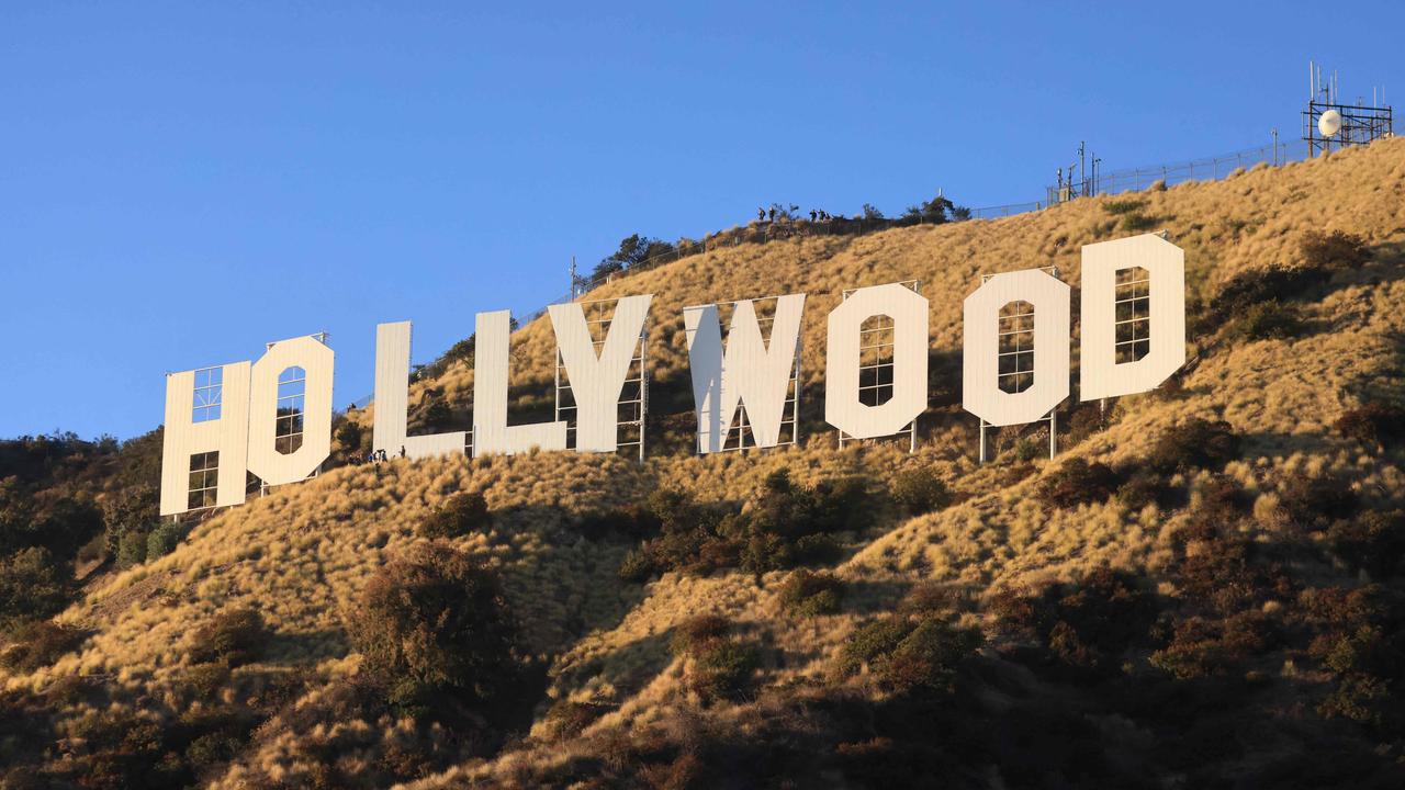 TOPSHOT – The Hollywood Sign is pictured during a ceremony marking the 100th anniversary of the first time it was lit, in Los Angeles, California, on December 8, 2023. (Photo by DAVID SWANSON / AFP)