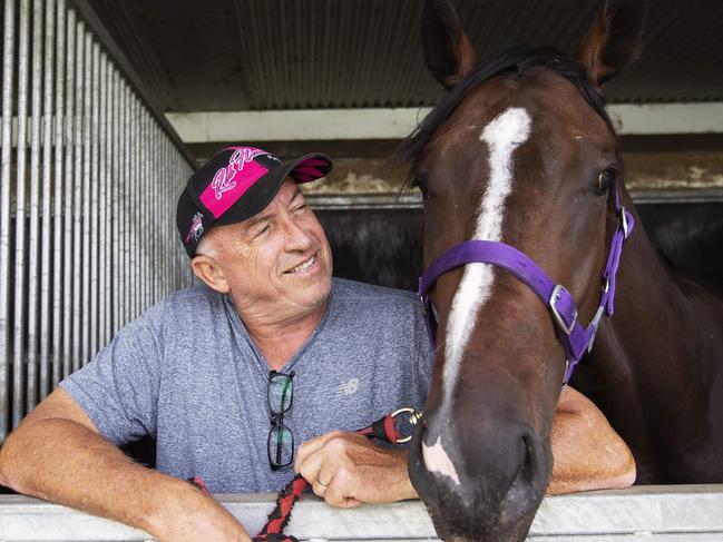 Trainer Rob Heathcote and Rothfire posing at Eagle Farm Racecourse, 230 Lancaster Rd, Ascot, Brisbane, 27th of February 2020. (AAP Image/Attila Csaszar)