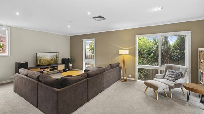 The house showcases multiple living areas.