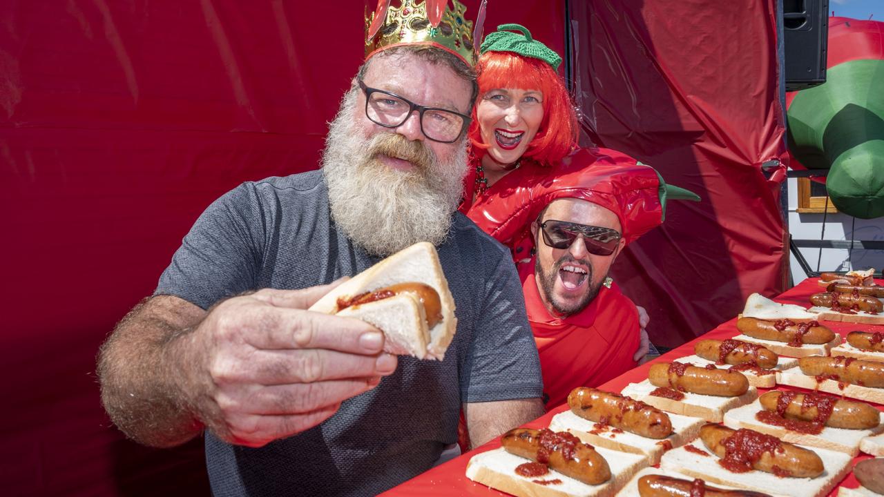 Damion Russell won the spicy sausage sizzle race to be crowned King at the Murphys Creek Chilli Festival. Pictured with Jason O'Connor and Madison Hebbard. Picture: Nev Madsen.