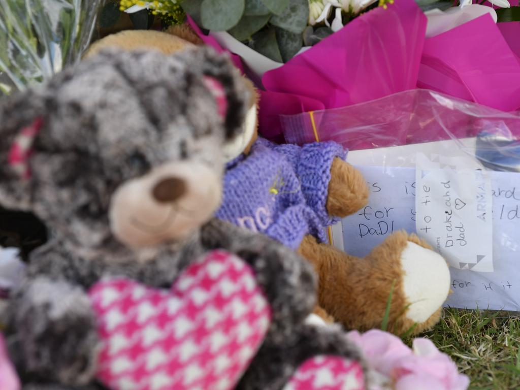 Flowers and soft toys left by community members. Picture: Kevin Farmer