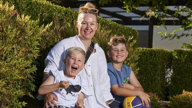 Harvey, 5, with mum, Lauren Jones, and brother, Hugh, 8 excited to get their jabs at in Wayville. Picture: Matt Loxton