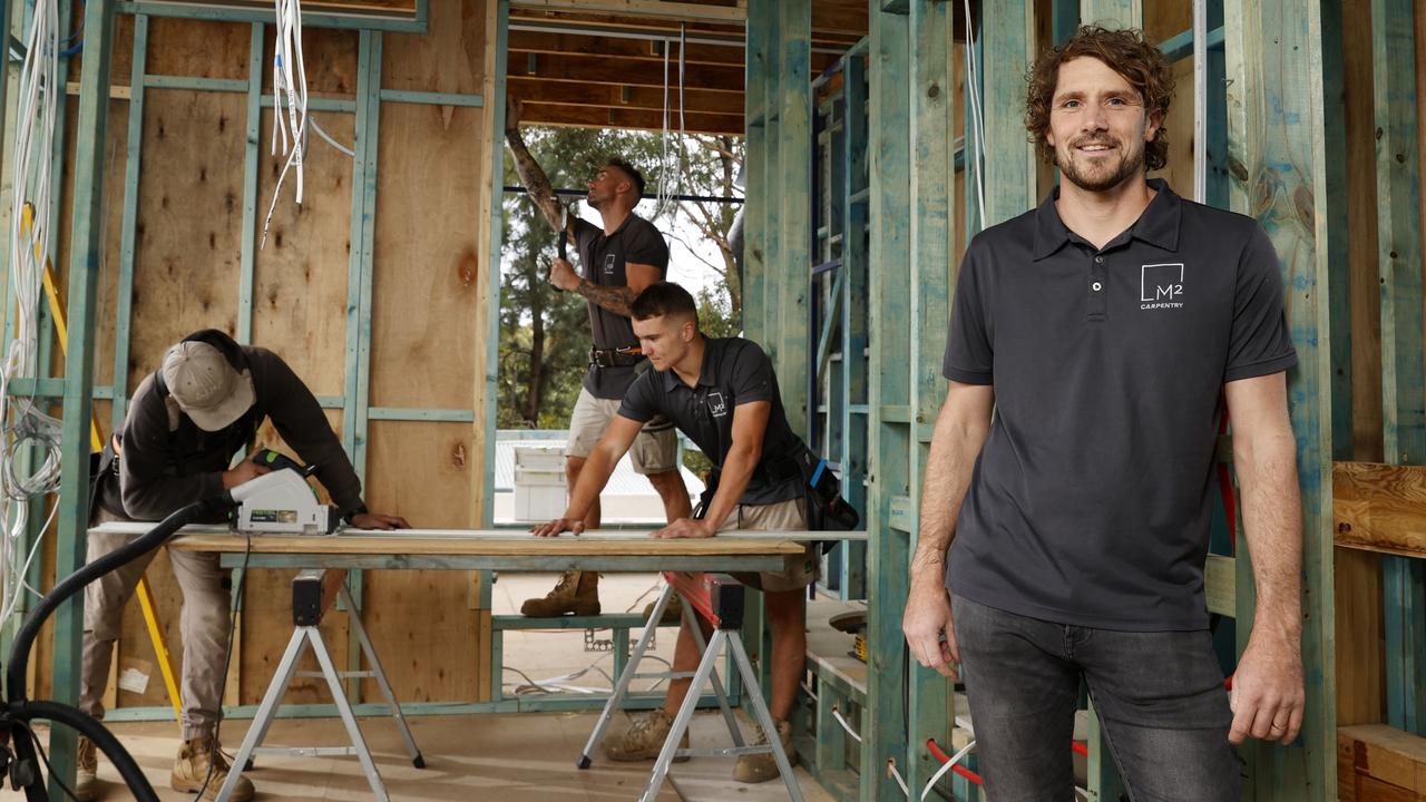 Mark Cook, the director of M2 Carpentry in Randwick, says a lack of qualified tradesman and escalating supply costs are hobbling building. Mark (right) pictured with workers, from left, Kieren Warner and apprentices Jonny McManus and Ben Mitchell at a job site in Kensington. Picture: Jonathan Ng