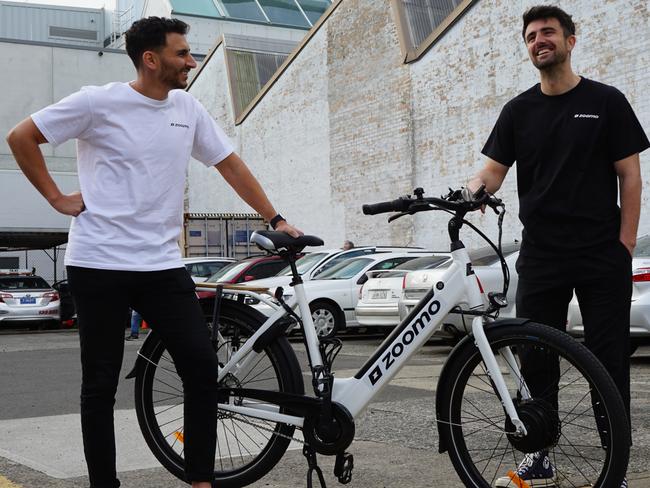 (L-R)  Zoomo co founder and CEO Mina Nada with co founder Michael Johnson. Zoomo has partnered with Dexus to offer discounted e-bike rentals and purchases to CBD office workers. Supplied 11.09.20