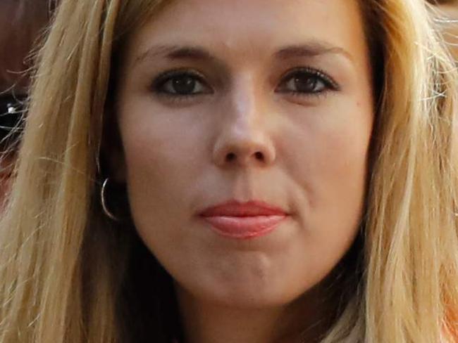 Carrie Symonds, girlfriend of Britain's new Prime Minister Boris Johnson, waits for the prime minister's arrival with members of staff in Downing Street in London on July 24, 2019 on the day he was formally appointed British prime minister. - Boris Johnson takes charge as Britain's prime minister on Wednesday, on a mission to deliver Brexit by October 31 with or without a deal. (Photo by Tolga AKMEN / AFP)