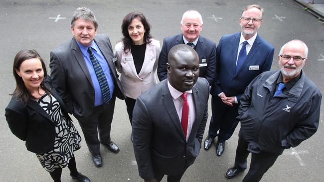 Sudanese community leader Maker Mayek with Melbourne mayors, from left, Kim Le Cerf, Geoff Porter, Kris Pavlidis, Bob Turner, John Kavanagh and Joh Mortimore in Brunswick yesterday. Picture: David Geraghty