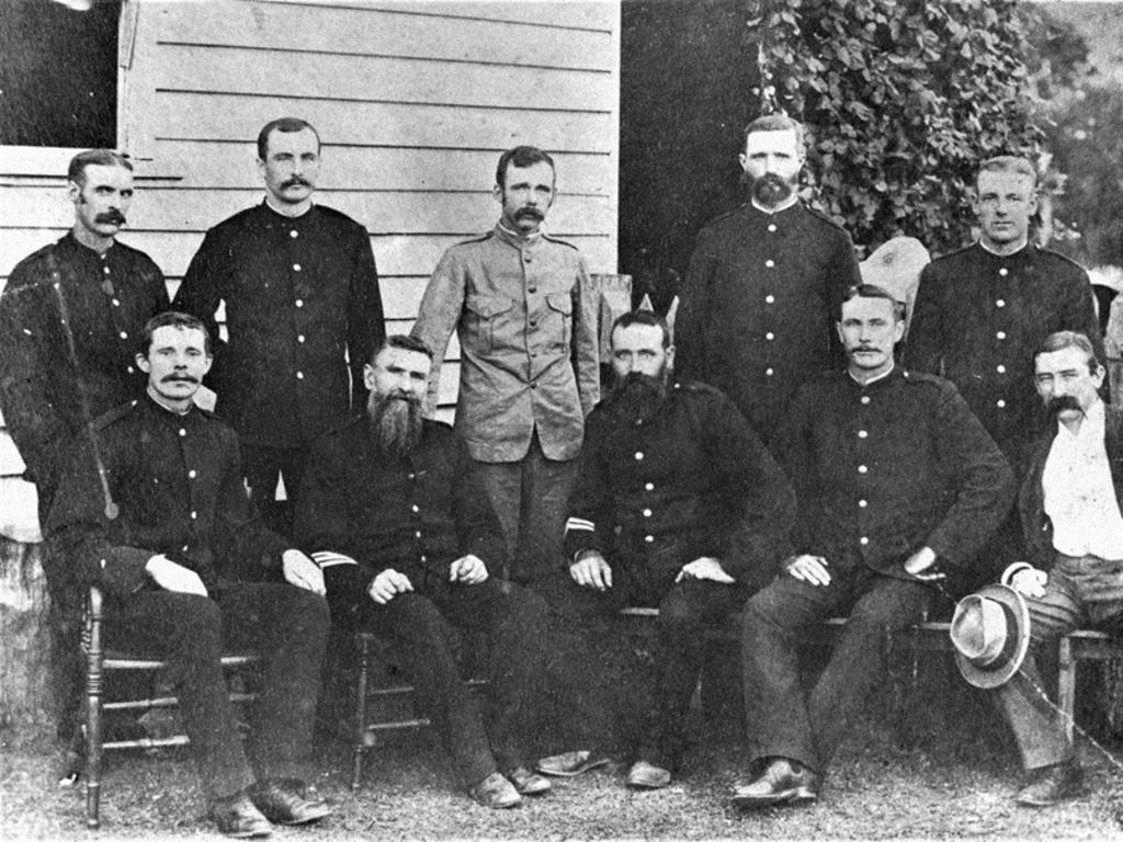 Police staff are photographed at the original Clermont Police Station in 1895.