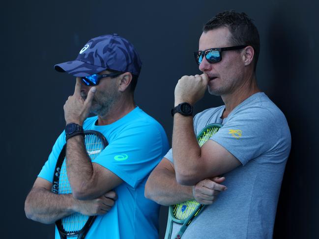 Lleyton Hewitt watches on as Alex de Minaur trains on Monday. Picture: Mark Stewart