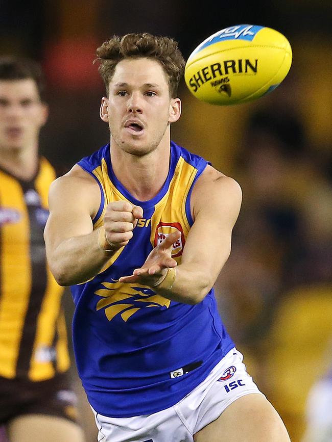 West Coast's Jack Redden clears by hand against Hawthorn at Etihad Stadium. Picture: Michael Klein