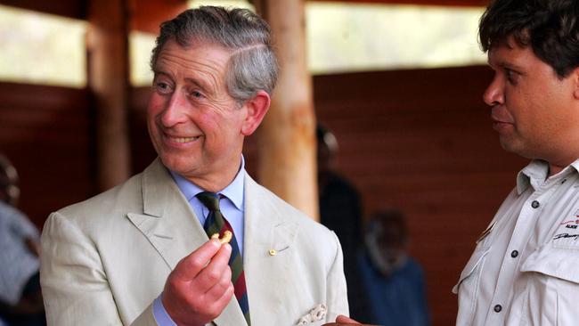 2005: Prince Charles holding a Witchetty Grub next to Alice Springs Desert Park ranger Doug Taylor.