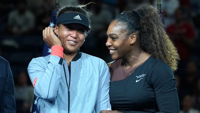 Naomi Osaka (left) is congratulated by Serena Williams following her US Open victory last year. Picture: AFP