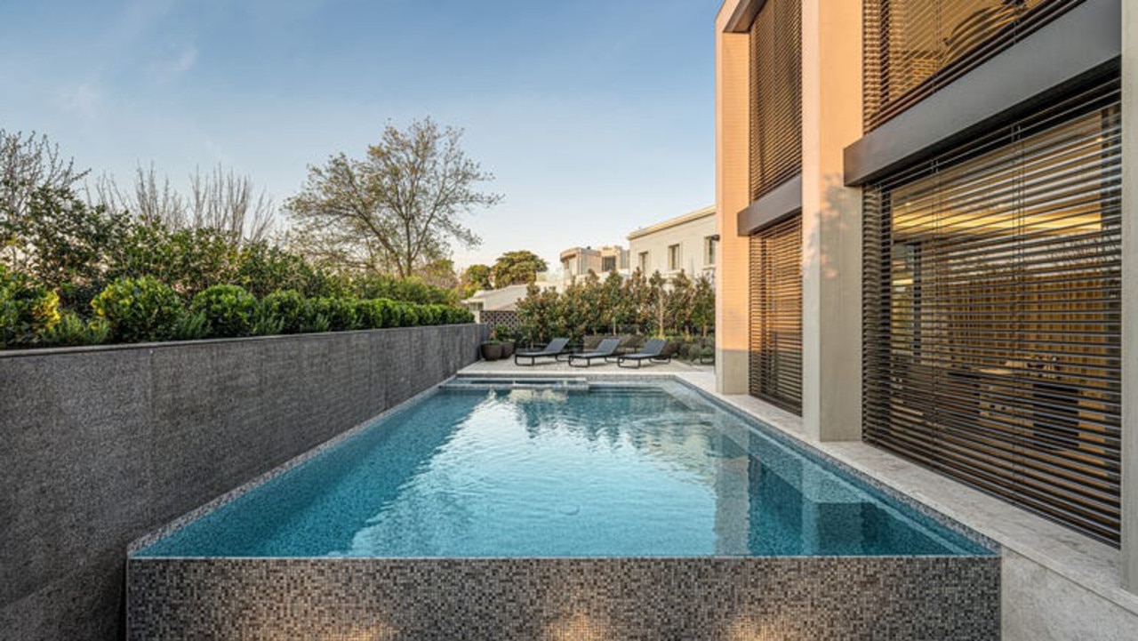 An infinity pool and spa in one of the house’s courtyards.