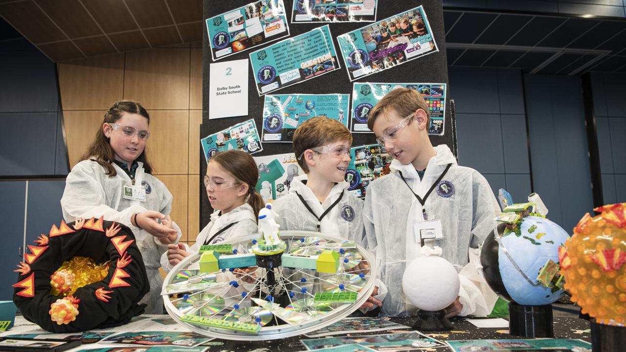 Dalby South State School students (from left) Indira Miers, Layla Read, Joshua Condon and Layten Pope discuss their black hole project in Kids in Space Queensland finals and showcase at Edmund Rice Cultural Centre St Mary's College, Friday, June 7, 2024. Picture: Kevin Farmer