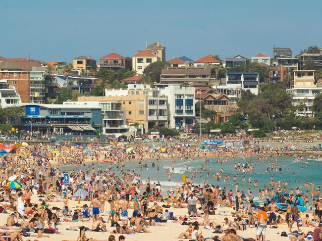 "Sydney, Australia - November 25, 2012: A large number of beach goers gather at the northern end of Bondi Beach on a hot Sunday afternoon." Australia crowds generic population