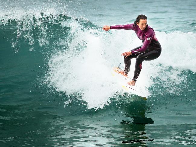 Seven-time world champion Beachley enjoys a surf at Freshwater Beach.