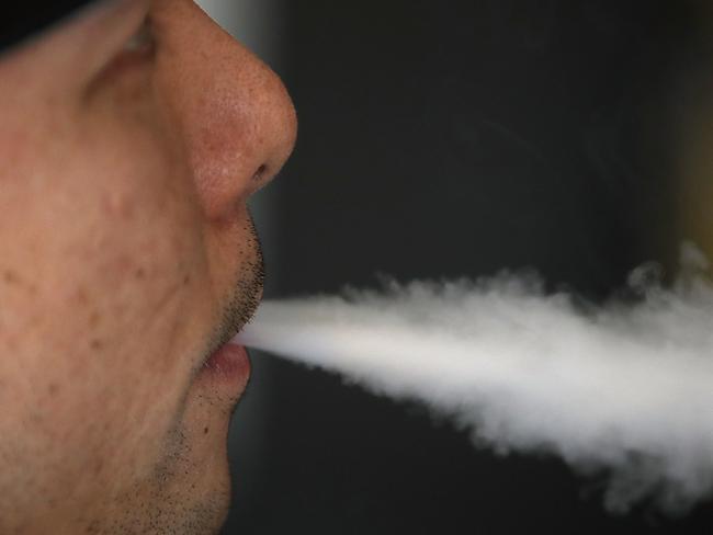 SOUTH SAN FRANCISCO, CA - JANUARY 23: Jeremy Wong blows vapor from an e-cigarette at The Vaping Buddha on January 23, 2018 in South San Francisco, California. According to a 600 page report by the National Academy of Sciences, Engineering and Medicine, vaping was found to be far less hazardous than smoking.   Justin Sullivan/Getty Images/AFP == FOR NEWSPAPERS, INTERNET, TELCOS & TELEVISION USE ONLY ==