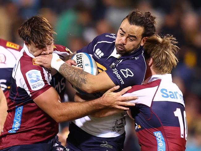 CANBERRA, AUSTRALIA - MAY 17: Andy Muirhead of the Brumbies is tackled during the round fourteen Super Rugby Pacific match between Brumbies and Reds at GIO Stadium, on May 17, 2025, in Canberra, Australia. (Photo by Mark Nolan/Getty Images)