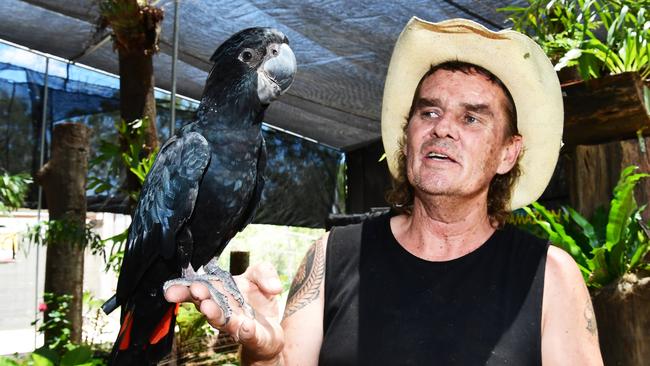 Flying High Bird Park owner Ian Dodds with a Red-tailed Black Cockatoo.