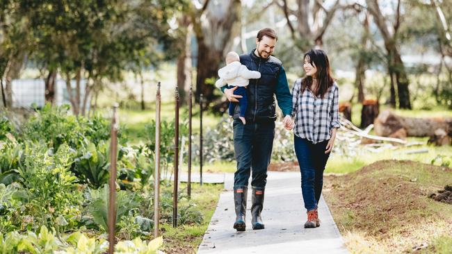 Jack Herry with his wife, Arisa, on their small farm at Wangaratta where they run an organic market garden. Picture: Chloe Smith