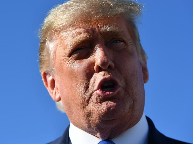 US President Donald Trump speaks to the press after steping off Air Force One upon arrival at Reno-Tahoe International Airport in Reno, Nevada en route to Carson City, Nevada for a rally on October 18, 2020. (Photo by MANDEL NGAN / AFP)