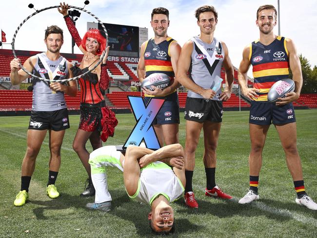 AFLX - Launch at Hindmarsh Stadium - Port players Sam Gray and Karl Amon and Crows players Jordan Gallucci and Rory Atkins - along with performers Miss Sparkle and acrobat - Ryan Divett. PIcture Sarah Reed