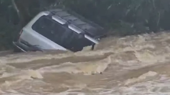 Images of a 4WD half submerged at Amamoor Crossing Creek Number 8, in the Mary Valley. Pictures: Carla Nerea, Facebook.