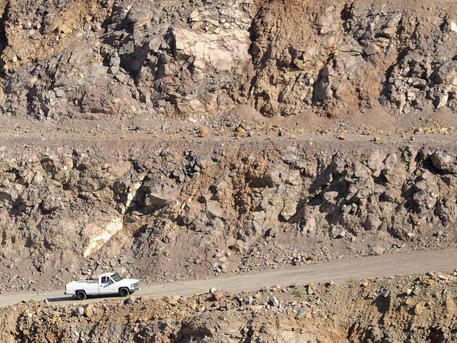 UNITED STATES - SEPTEMBER 10:  A pick-up truck makes its way out of the Molycorp Mountain Pass open pit mine in Mountain Pass, California, U.S., on Thursday, Sept. 10, 2009. Molycorp Minerals LLC, the only U.S. producer of rare earths, may spend up to $400 million expanding output by more than nine times to meet rising minerals demand from makers of hybrid cars, computer chips and televisions. China currently accounts for more than 90 percent of global rare earth output.  (Photo by Jacob Kepler/Bloomberg via Getty Images)