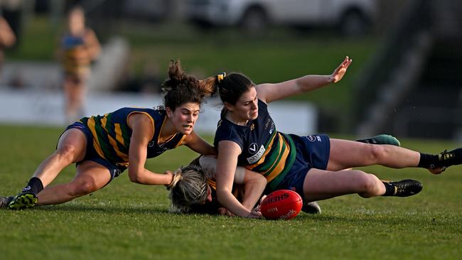 VAFA: St Kevin’s Abigail Bloom and Tayla Nichols take down Kew’s Maggie McDonough. Picture: Andy Brownbill