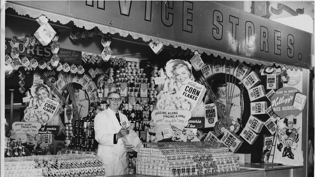 Grocery pioneer Tom George manning a Home Service Stores sample bag stall at the Royal Adelaide Show in the 1950s.