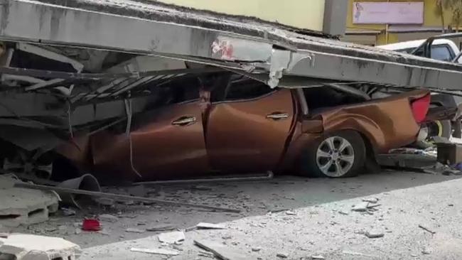 A car crushed following the earthquake.