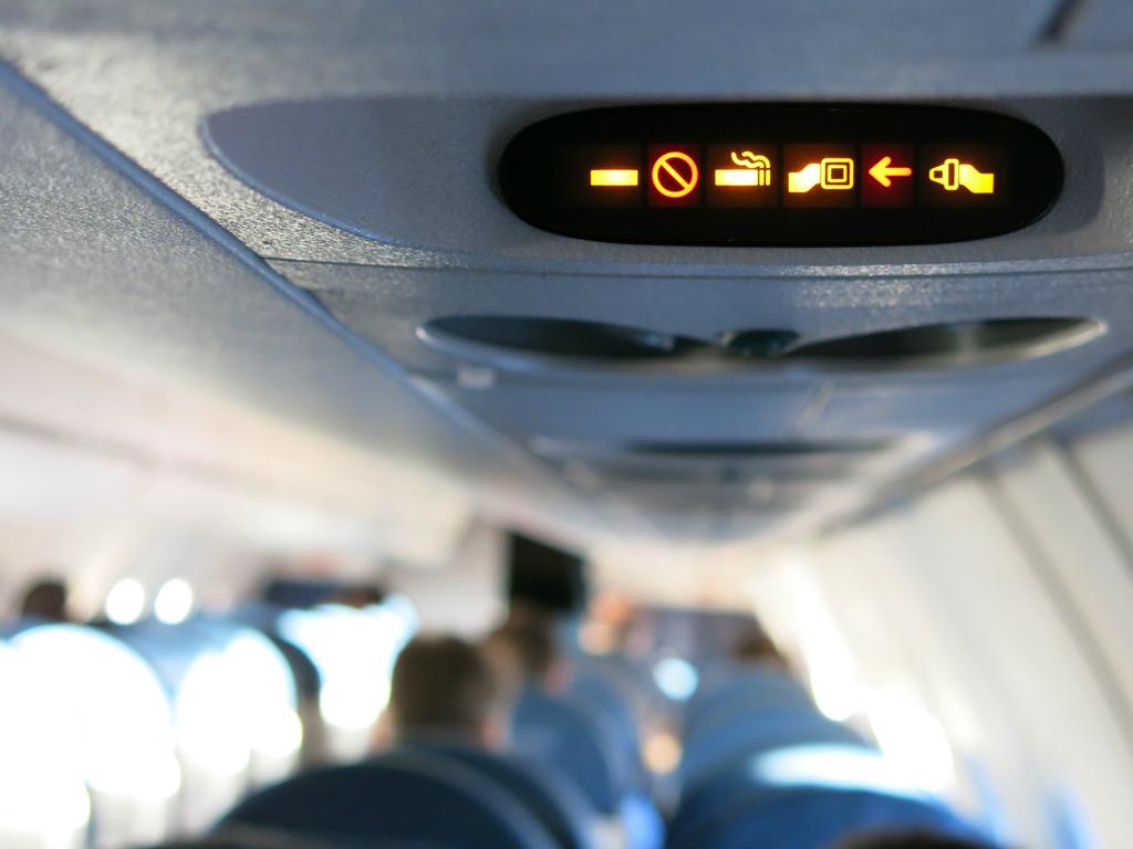 No smoking signs remain on planes even though smoking was banned on board decades ago