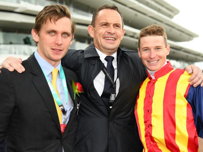 Charlie Duckworth and trainer Chris Waller with jockey James McDonald after he rode Nature Strip to victory