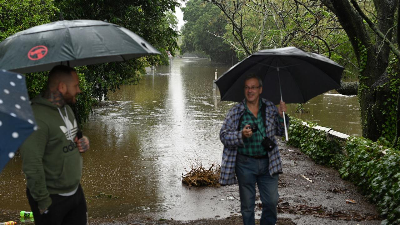 Residents check flood damage in the Windsor area in northwestern Sydney. Picture: Saeed Khan/AFP