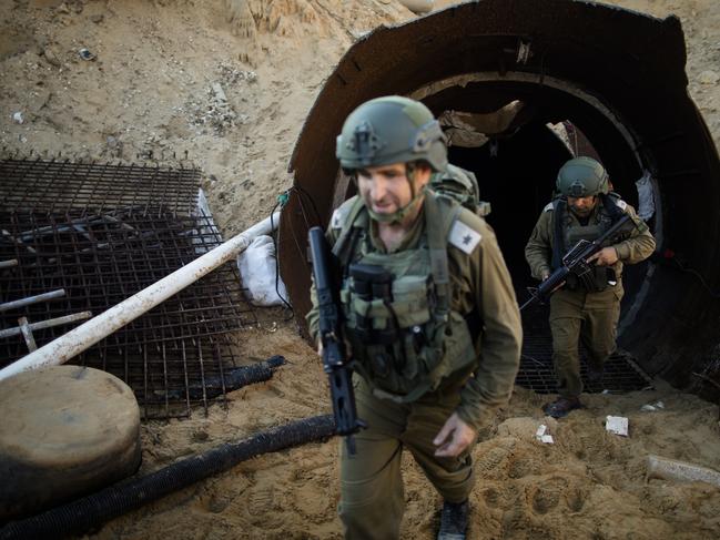 Israeli soldiers exit a Hamas tunnel near the border with Israel. Picture: Getty Images.