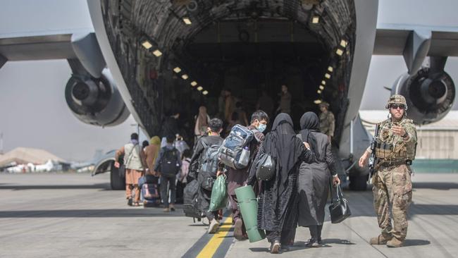 Families begin to board a US Air Force Boeing C-17 Globemaster III during an evacuation at Hamid Karzai International Airport on Monday, August 23, 2021. Picture: AFP/Samuel Ruiz