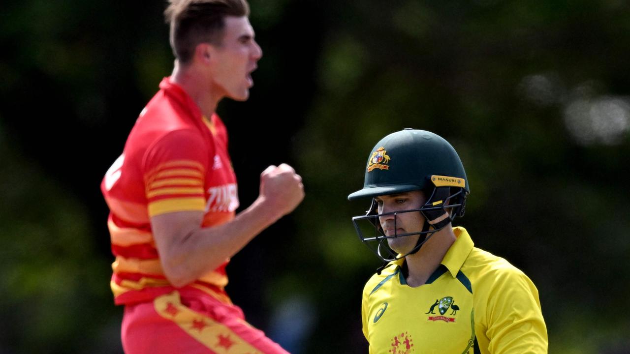 Australia's batsman Alex Carey walks off after being dismissed by Zimbabwe's Brad Evans. Photo by William WEST / AFP