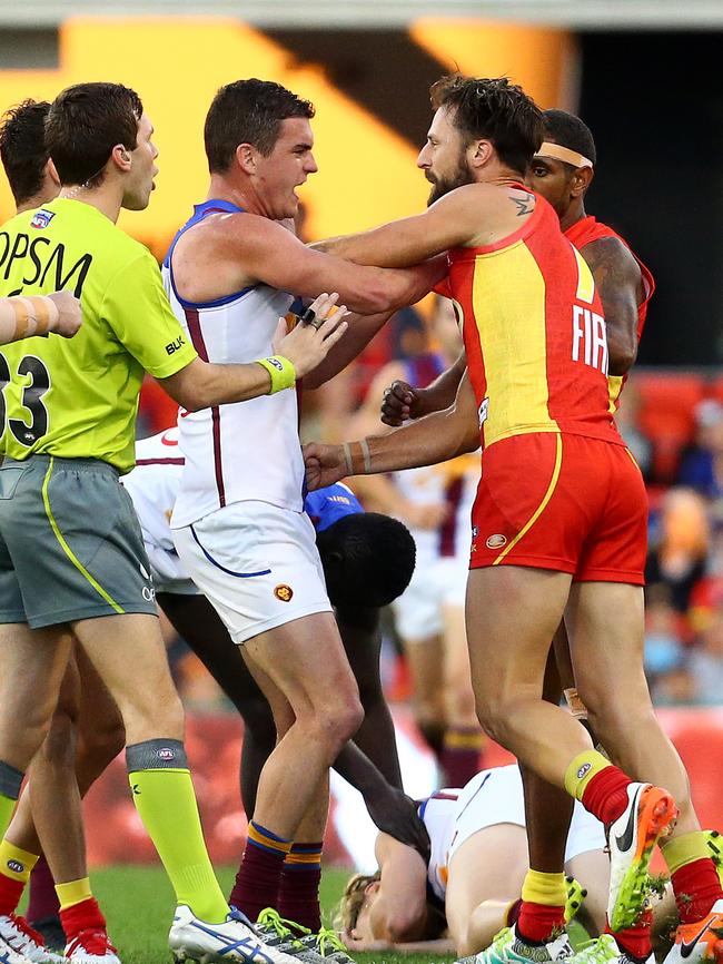 Tom Rockliff gets in the face of Nick Malceski during a QClash between the Gold Coast Suns and Brisbane Lions at Metricon Stadium. Picture: Adam Head