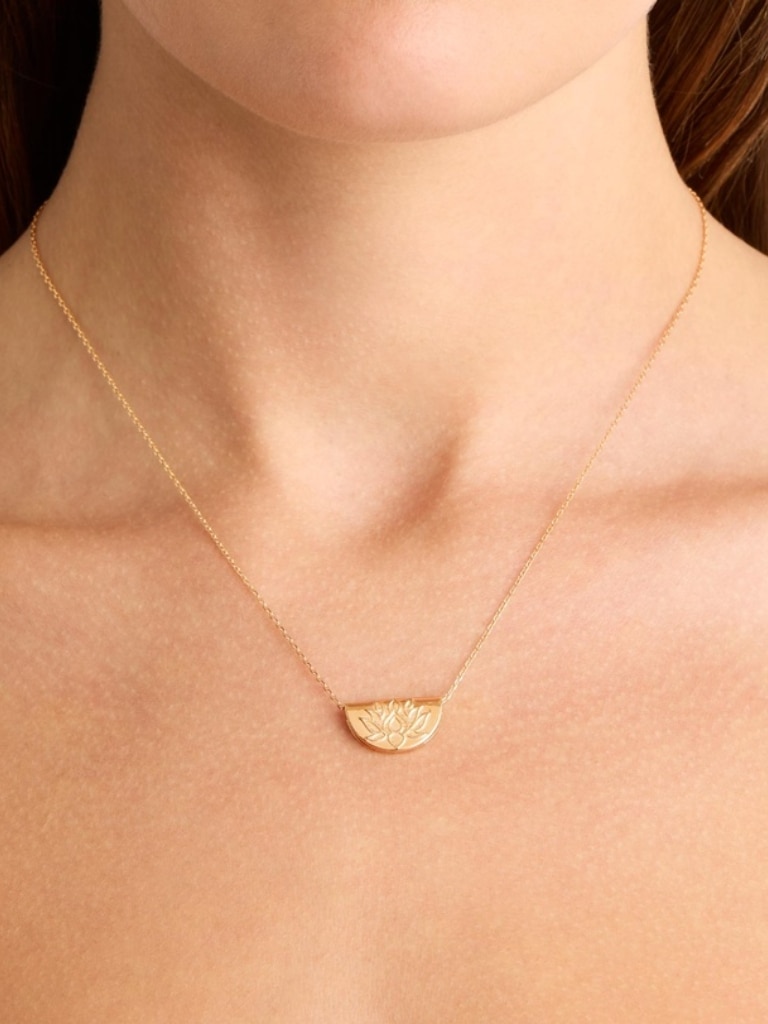 By Charlotte Gold Lotus  Short Necklace. Picture: THE ICONIC.